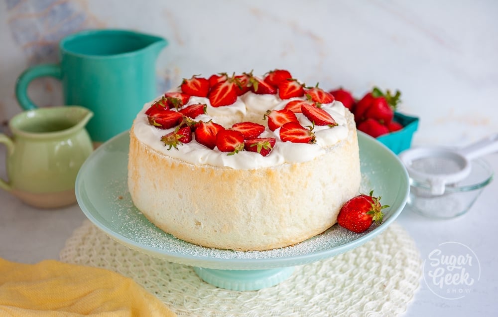 angel food cake topped with whipped cream and strawberries
