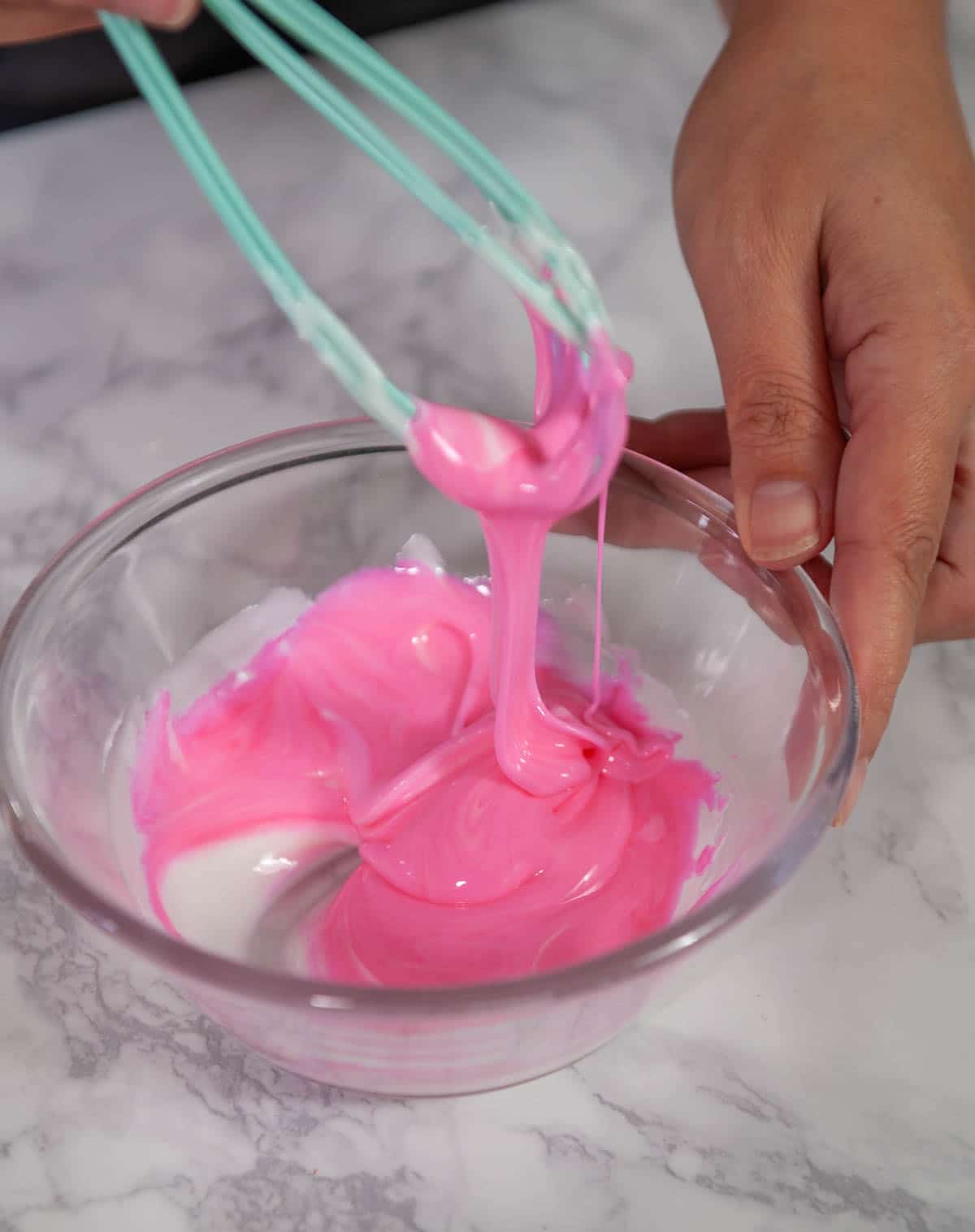 coloring donut glaze with pink and blue food coloring
