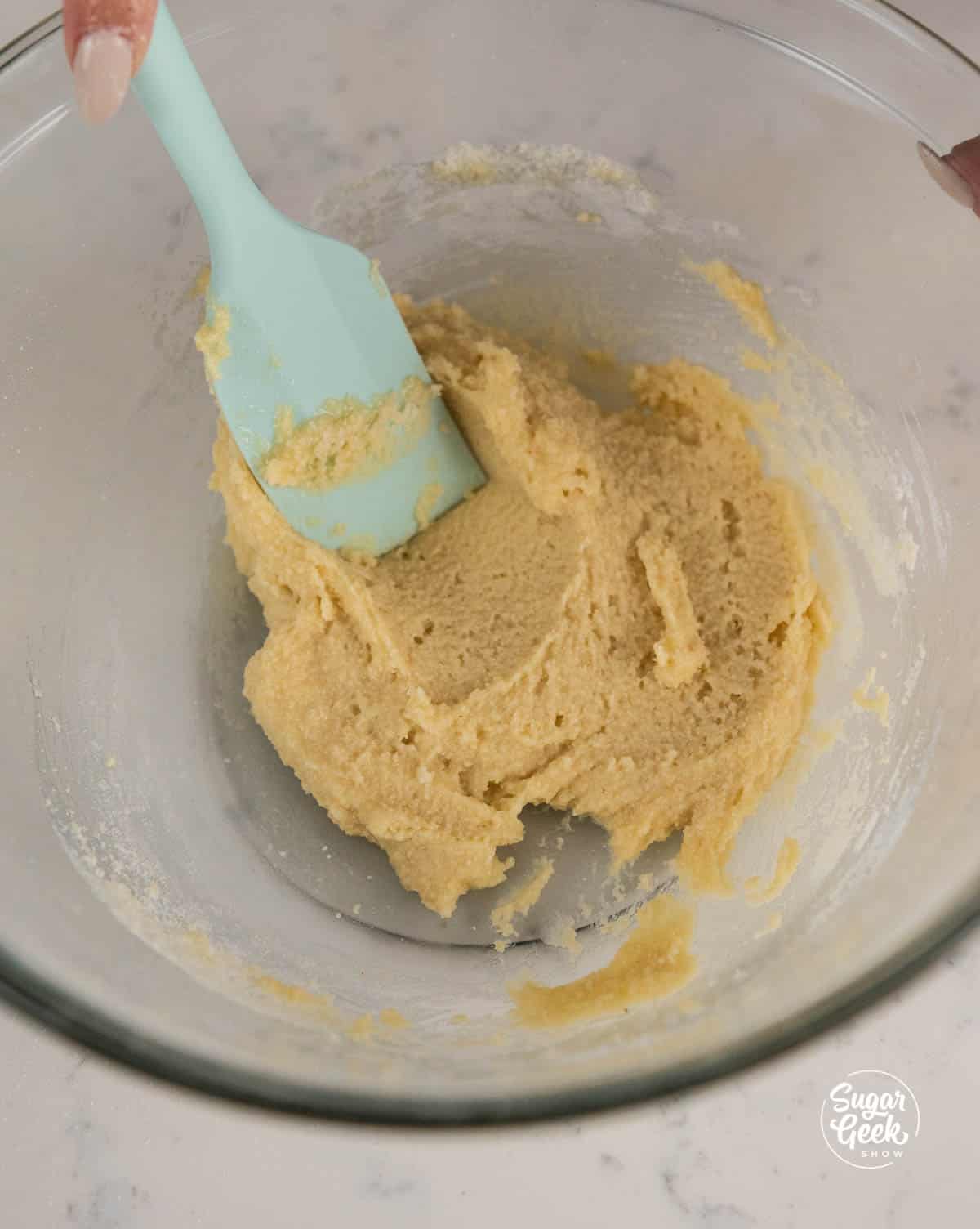 mixing almond flour mixture with egg white