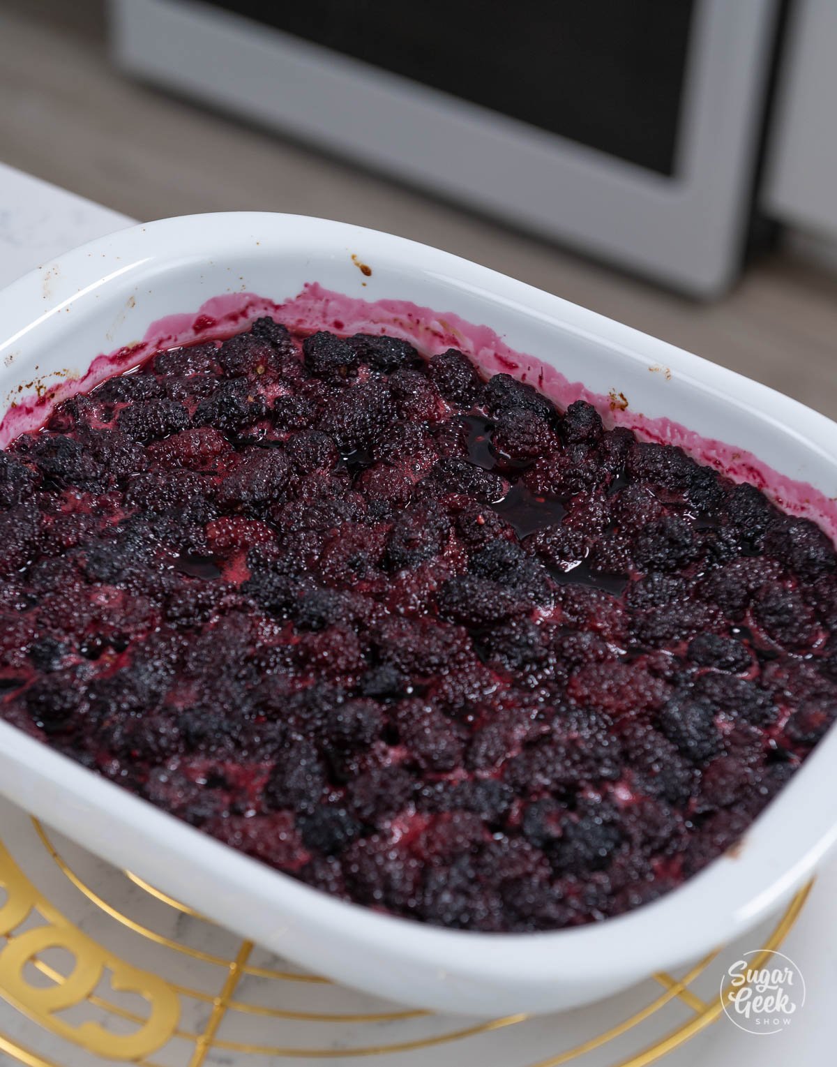 hot blackberries in a white baking dish
