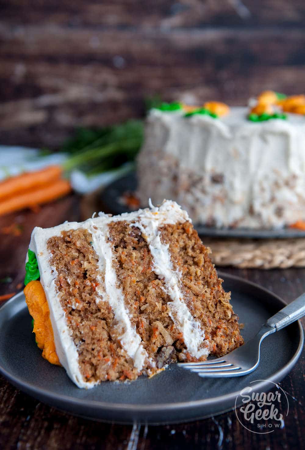 carrot cake with pineapple, candied pecans, toasted coconut and big chunks of carrots. Frosted with brown butter cream cheese frosting