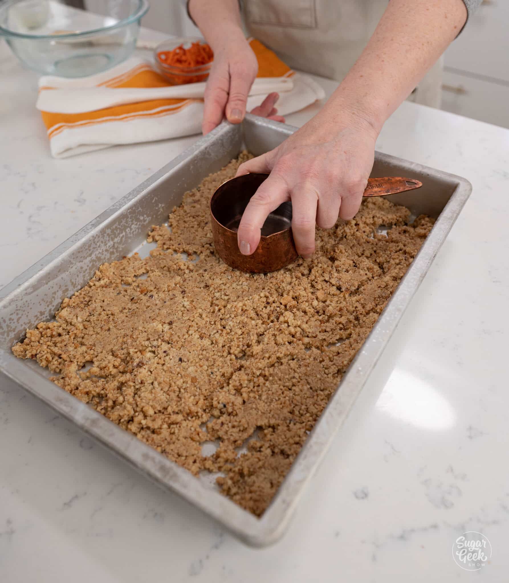 Pressing crust into a baking pan