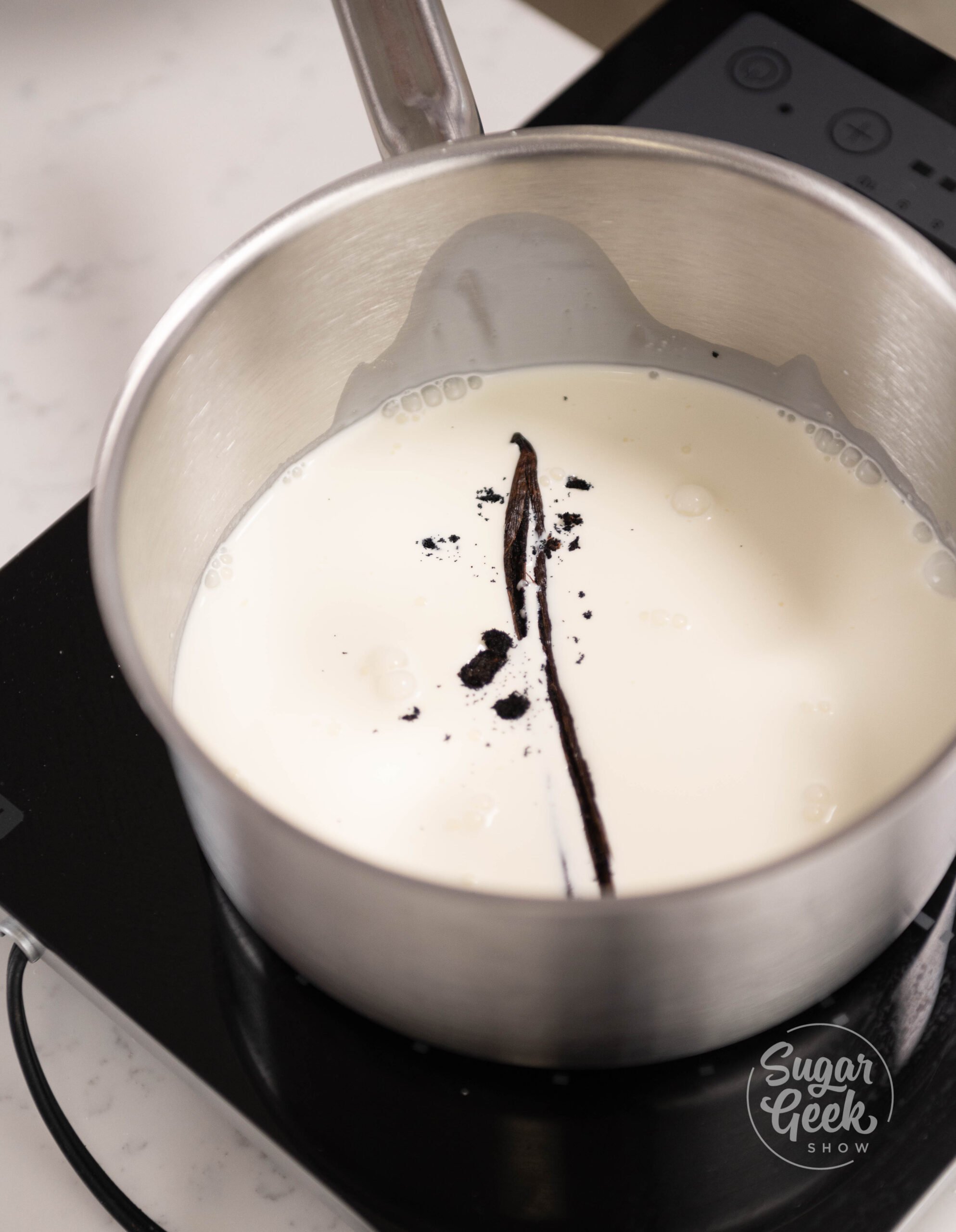 pot of cream with vanilla inside