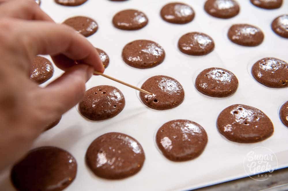 popping bubbles in chocolate macaron batter