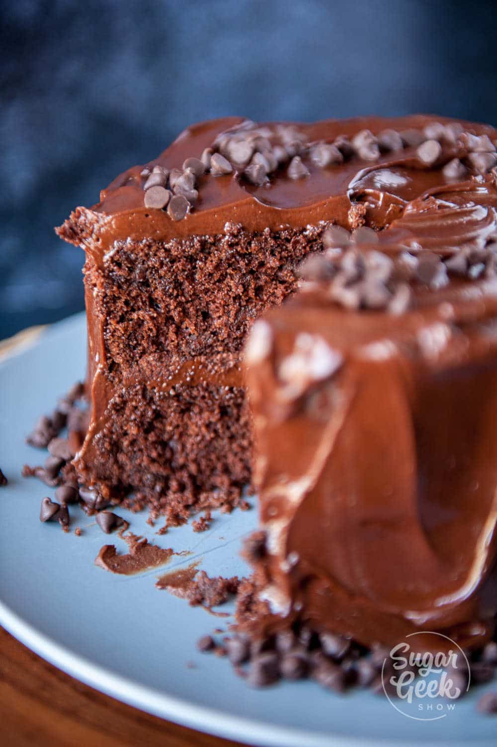 close up of chocolate cake with slice cut out of it