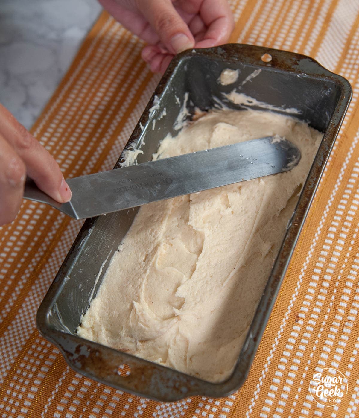 smoothing cake batter with spatula