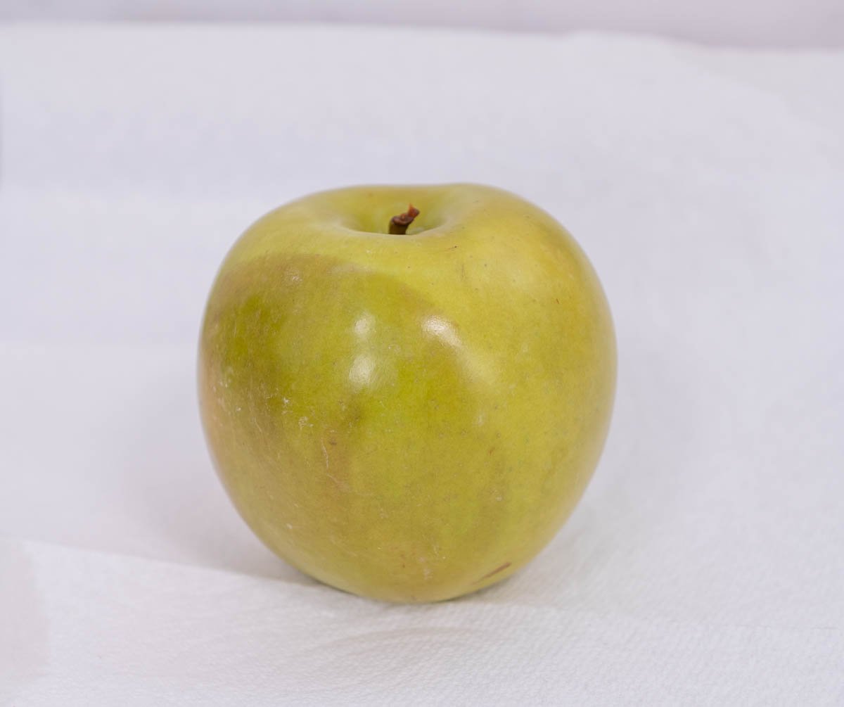 close up of green apple with brown skin