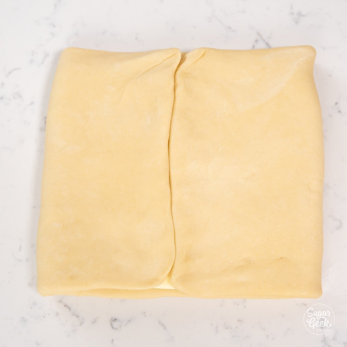croissant dough folded with a seam down the center