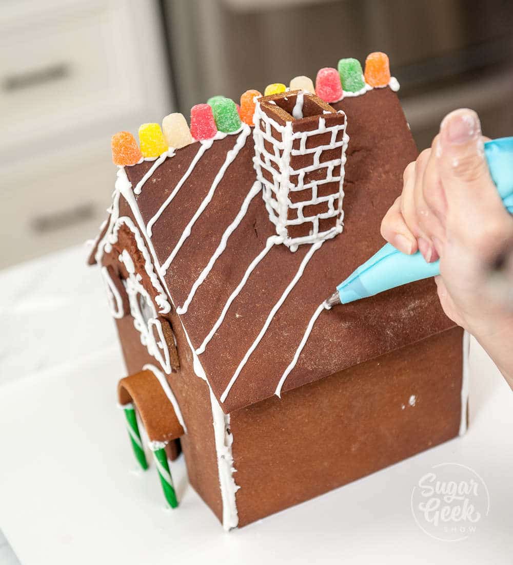 decorating the curved roof gingerbread house