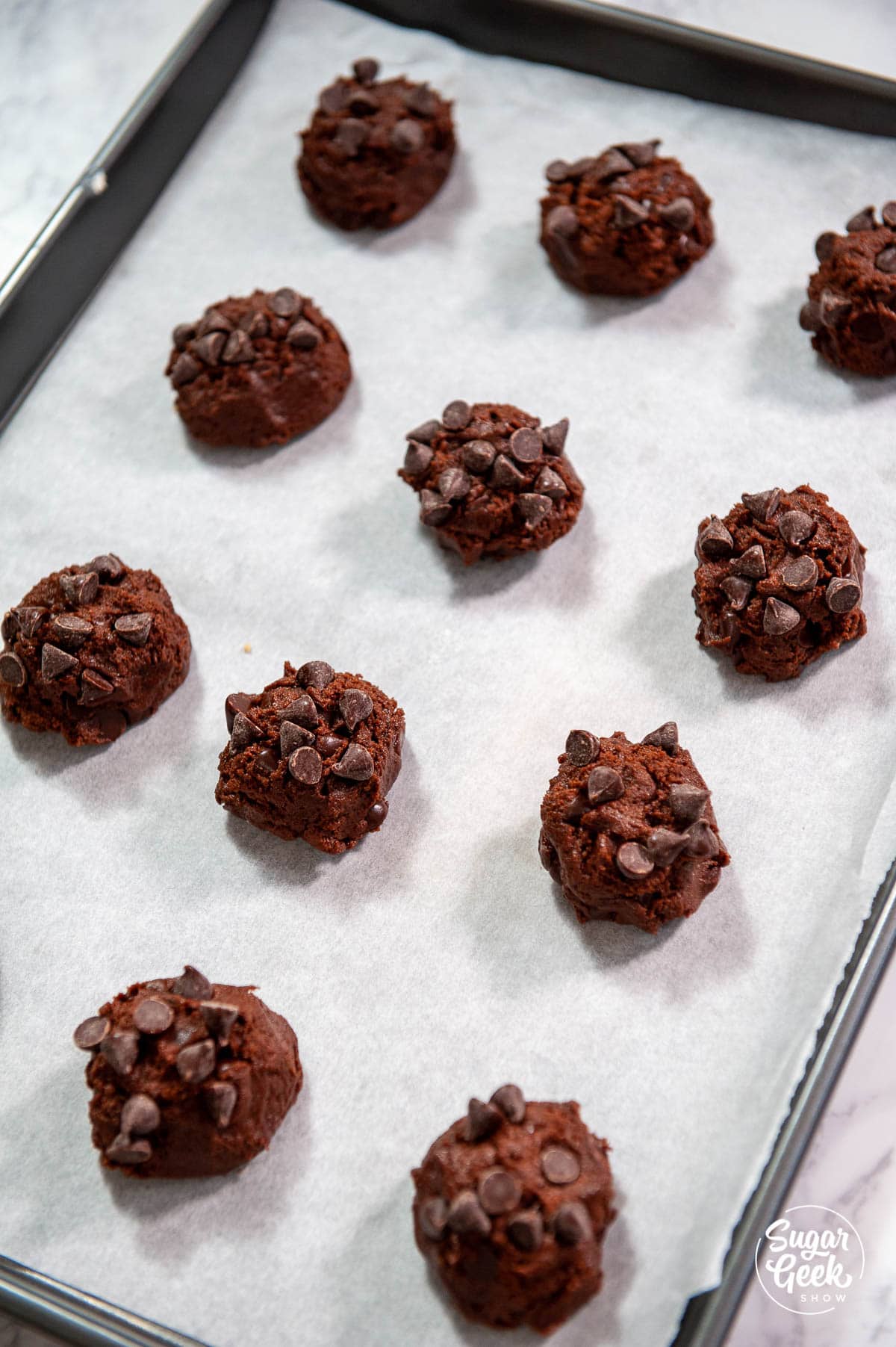 rolling double chocolate chip cookie dough into balls