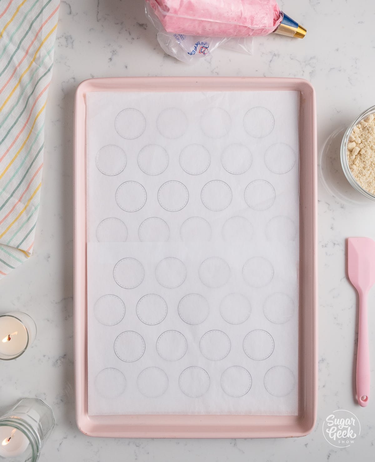 baking tray lined with parchment paper and macaron templates