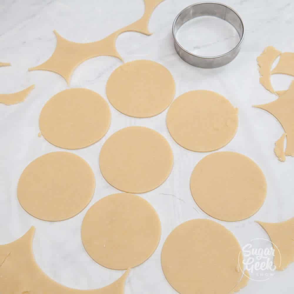 circles of hand pie dough on a white surface