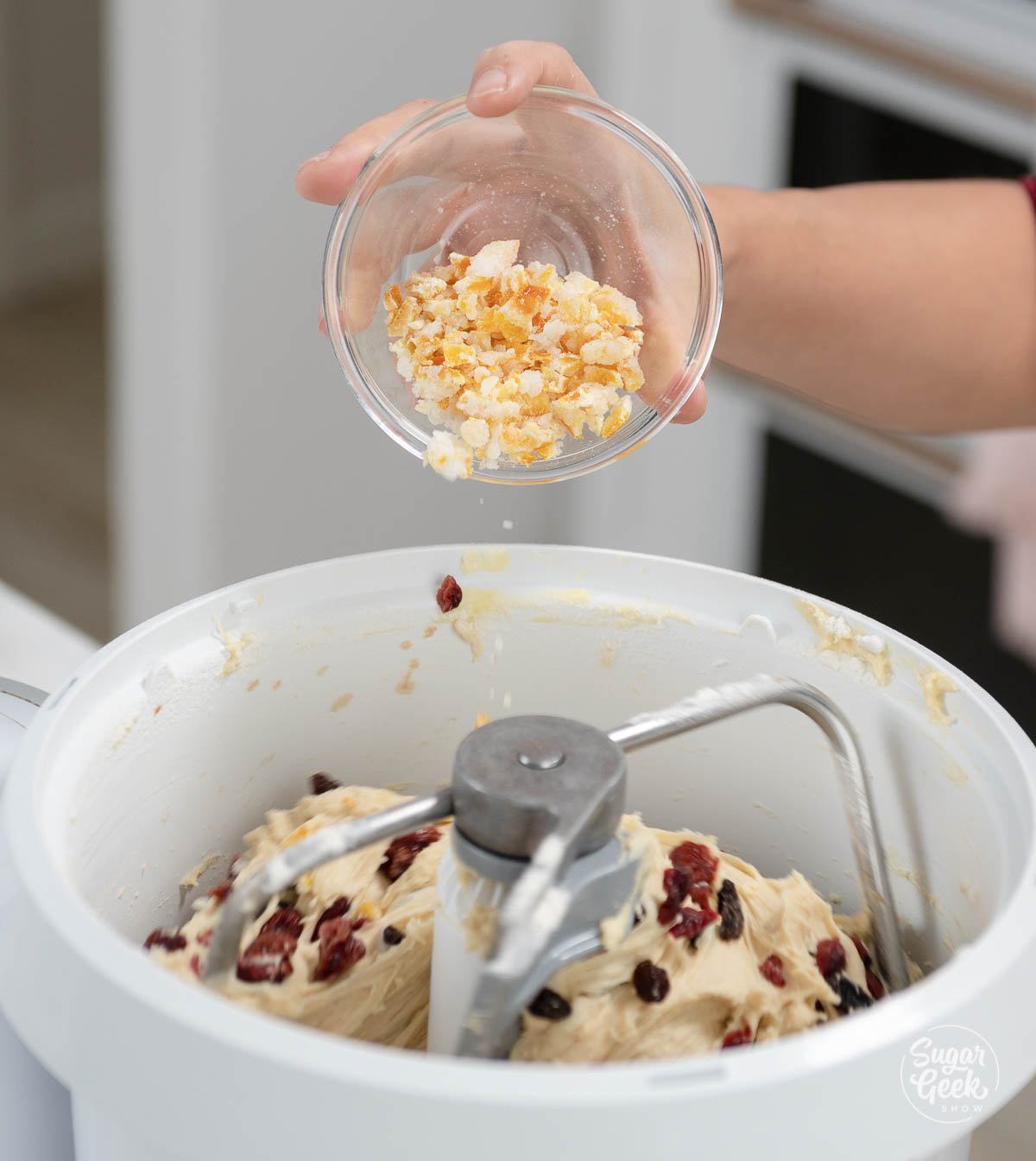 adding dry fruit and zest to panettone dough
