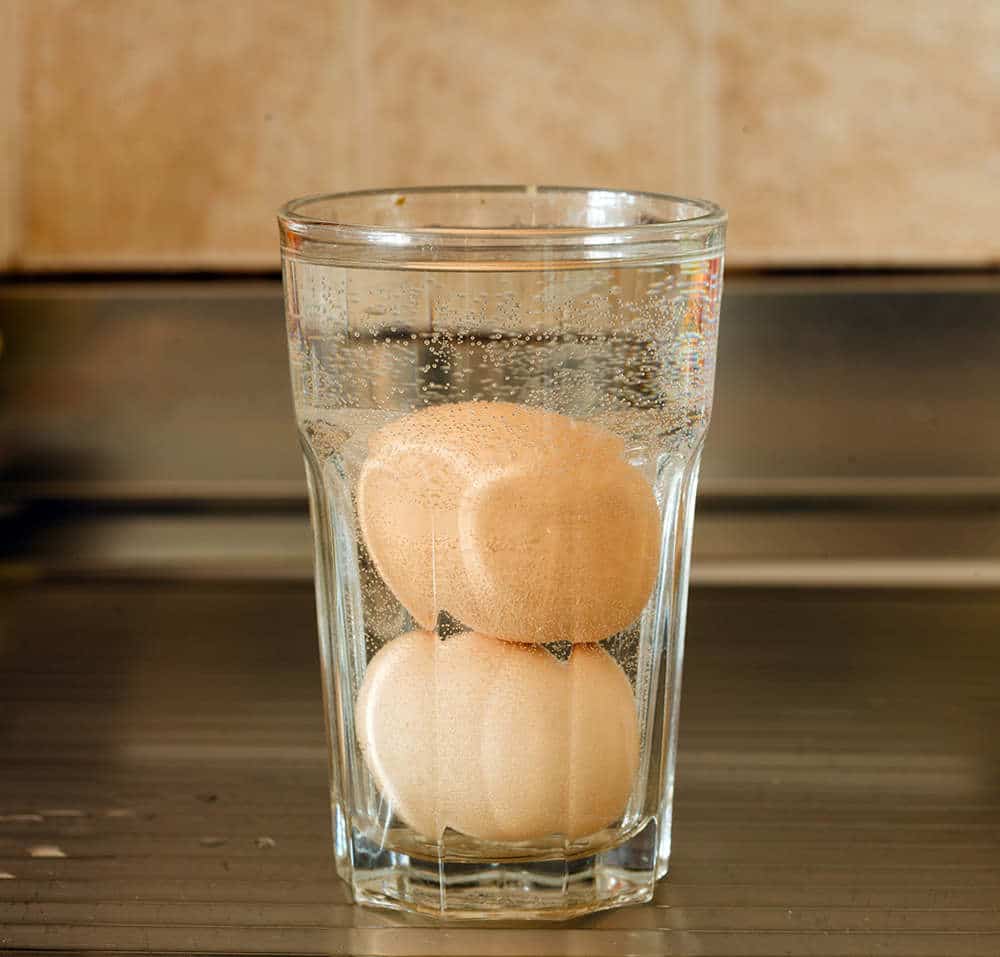 place cold eggs in a glass of warm water for 10 minutes to warm them up