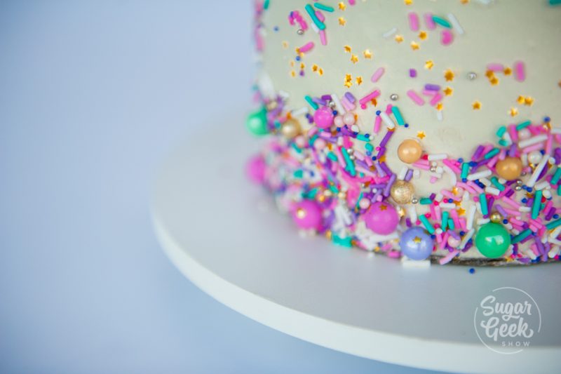 sprinkles on the side of a cake