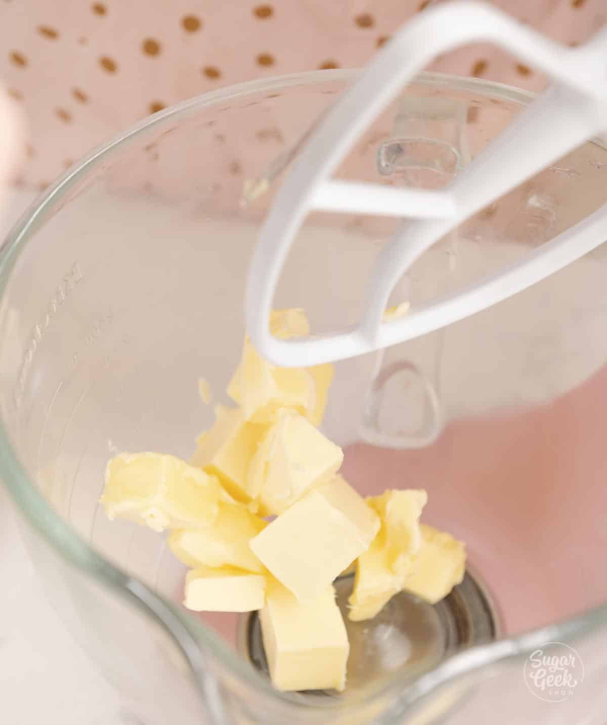 cubed butter in a stand mixer with the paddle attachment above