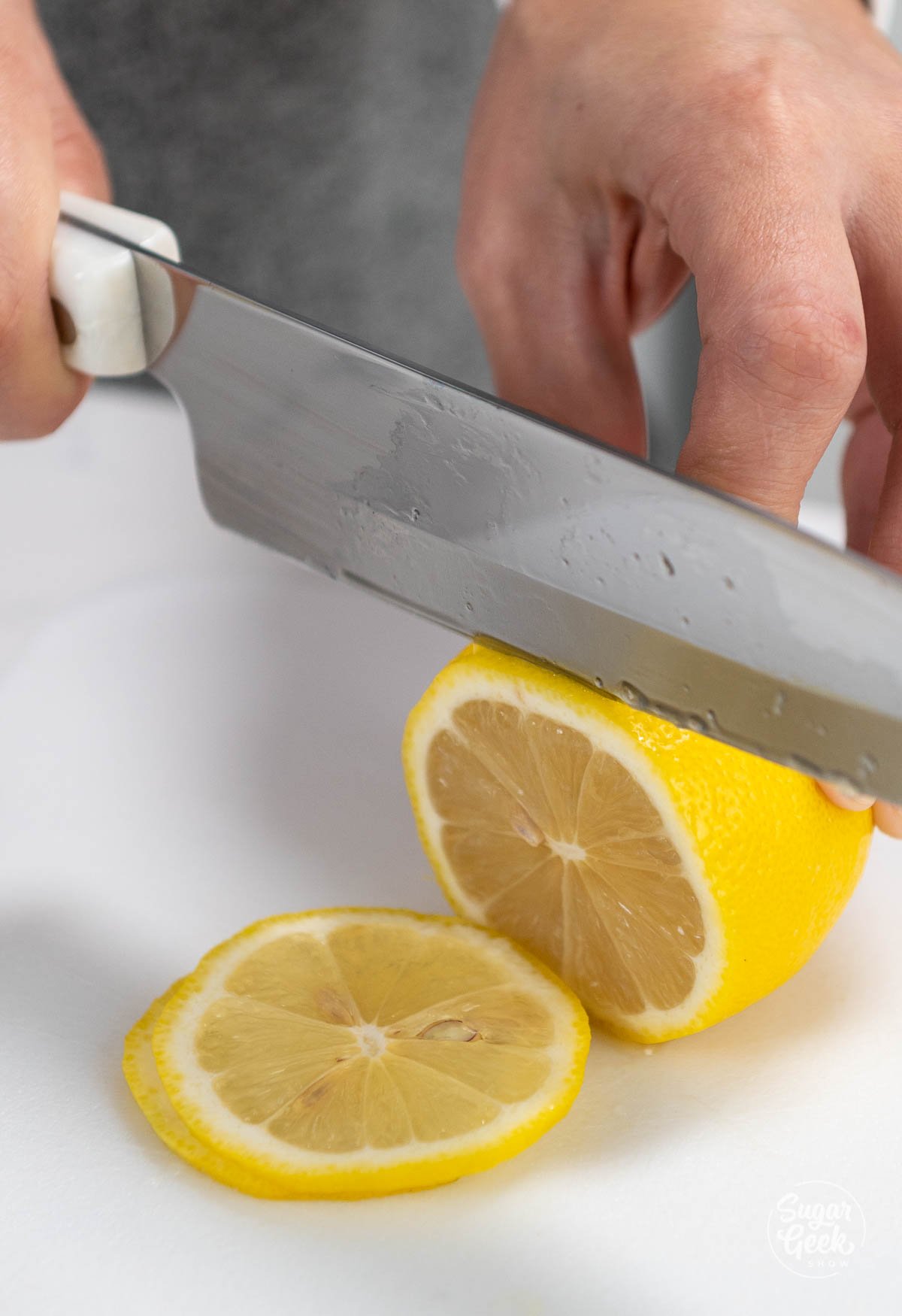 cutting a lemon with a knife