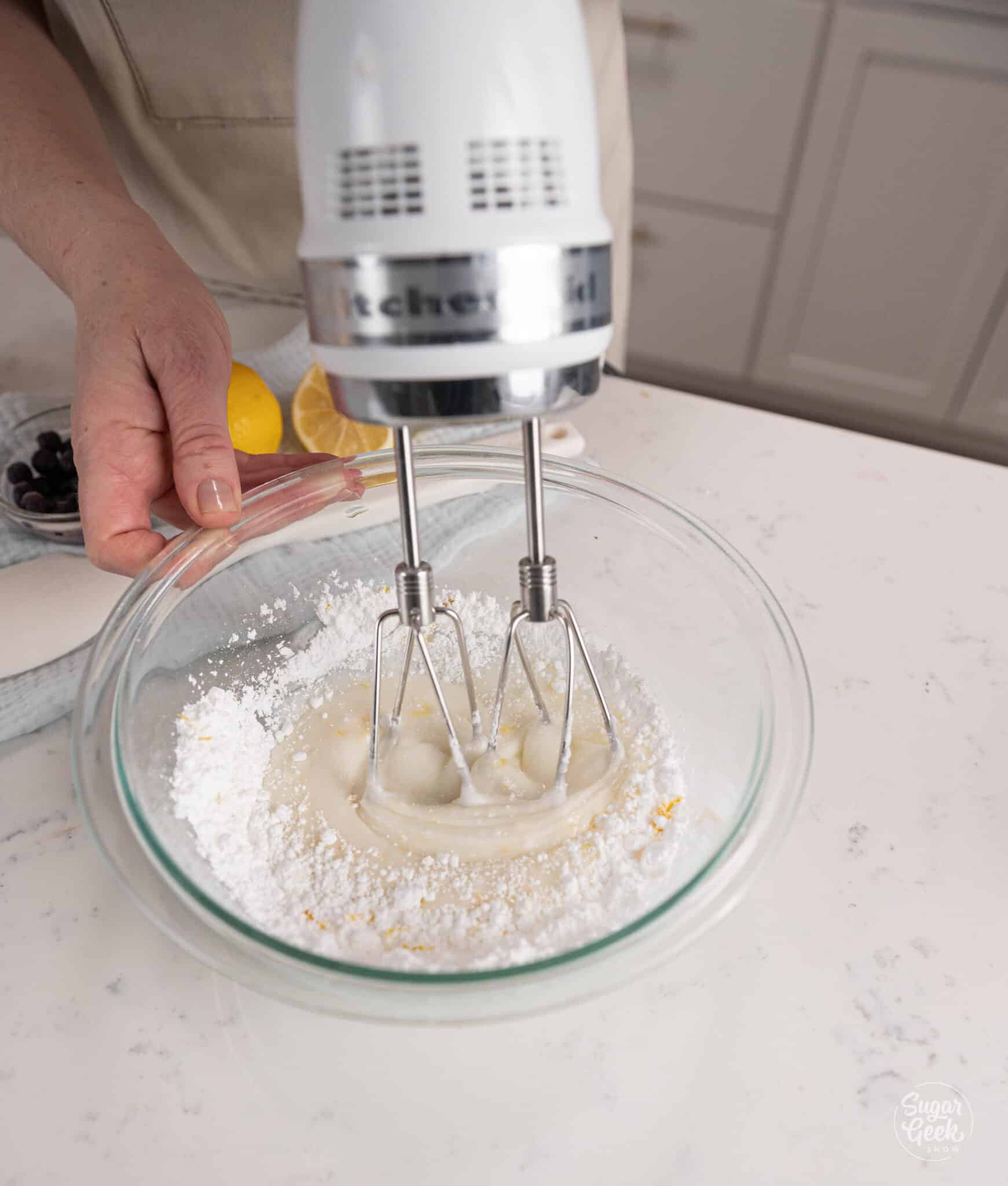 mixing glaze ingredients with a hand mixer