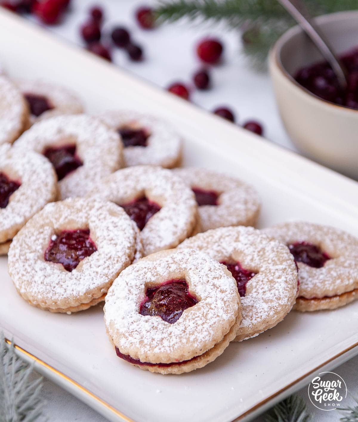 linzer cookies on a white plate