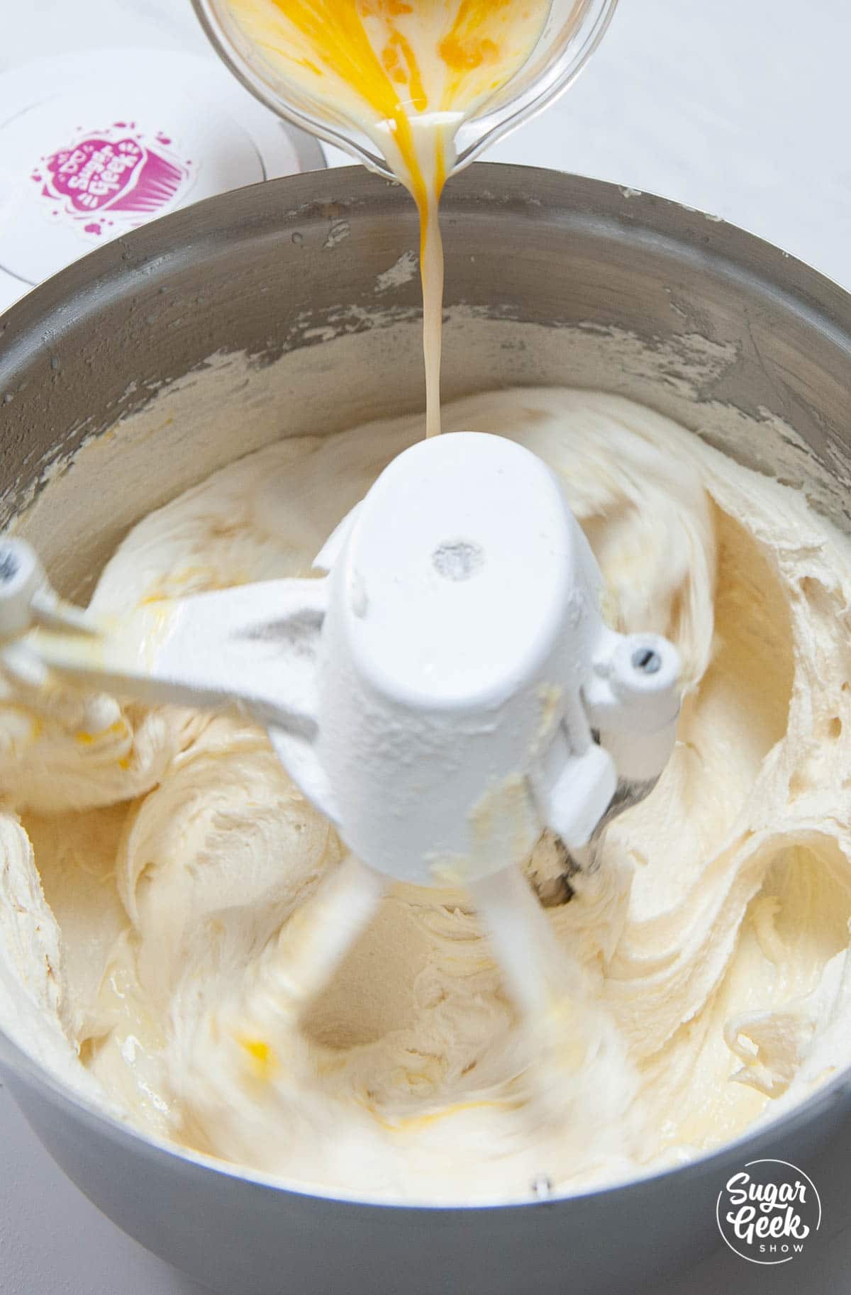 adding the egg mixture to the vanilla cake ingredients