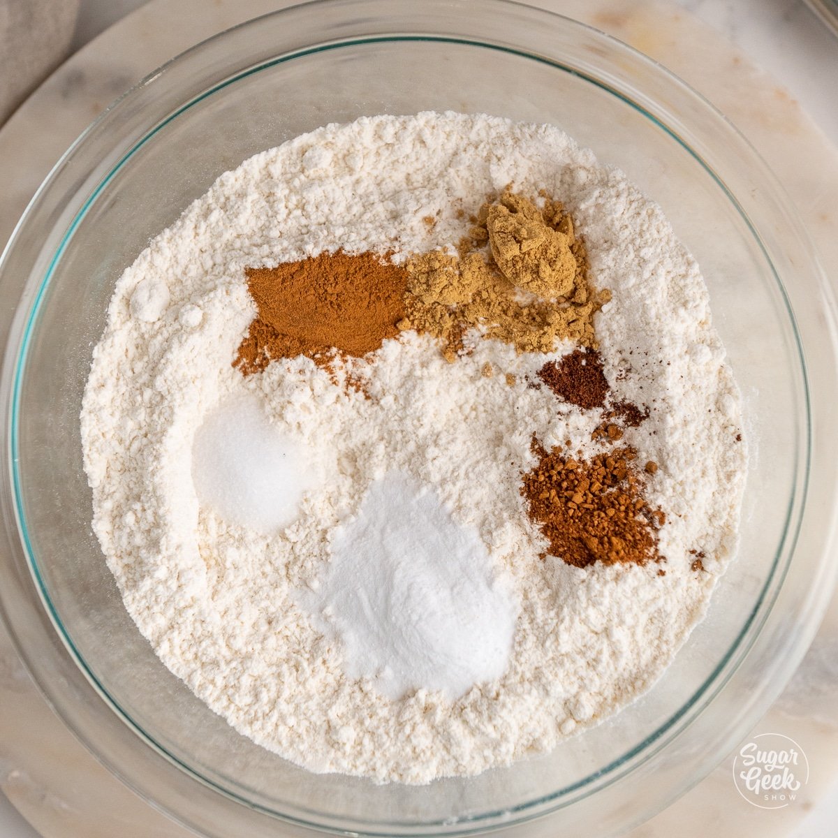 dry ingredients for molasses cookies in a large glass bowl