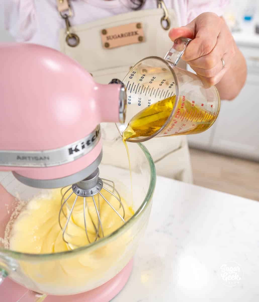 drizzling olive oil into a stand mixer bowl