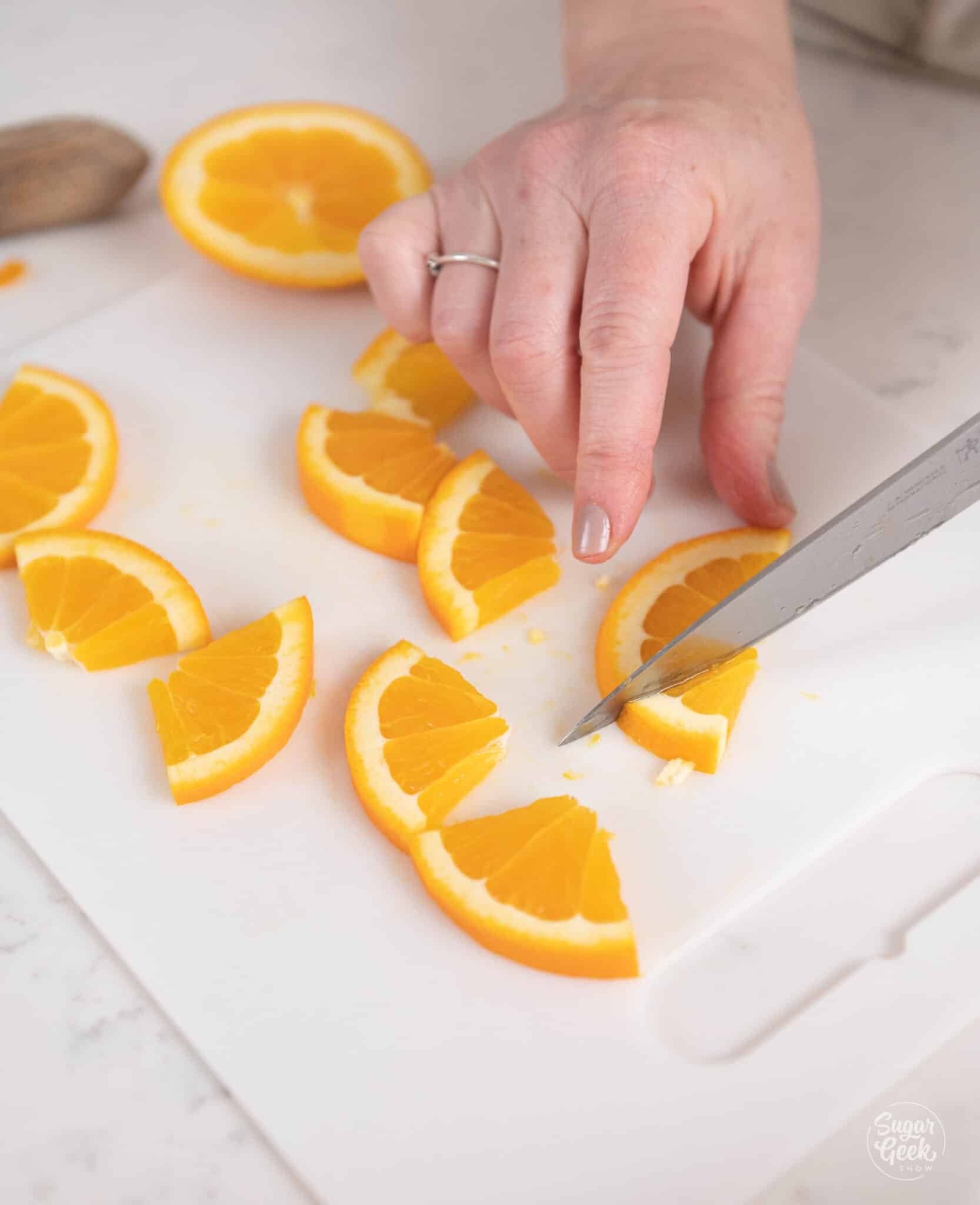 slicing oranges with a knife