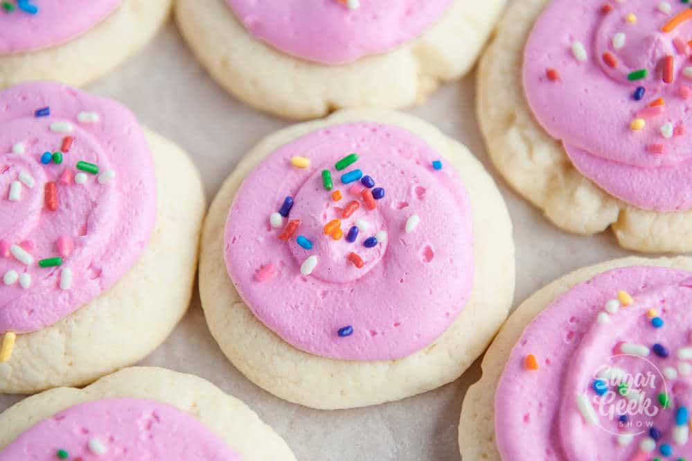 copycat lofthouse cookies with pink buttercream frosting and rainbow sprinkles