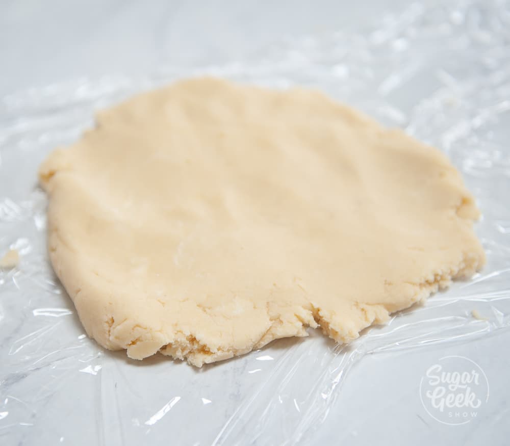 tart dough on plastic wrap