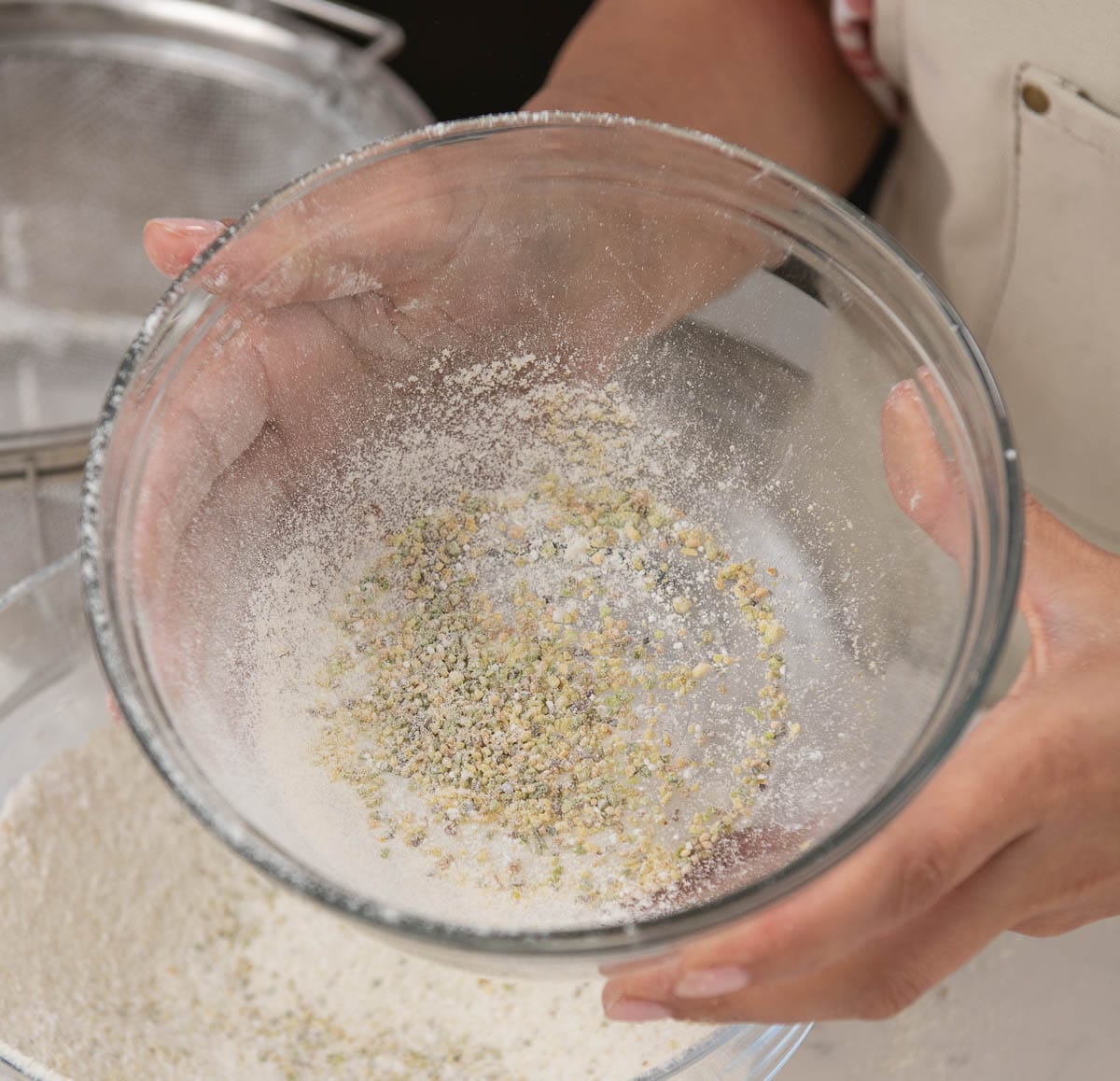 large pieces of pistachio in a sifter