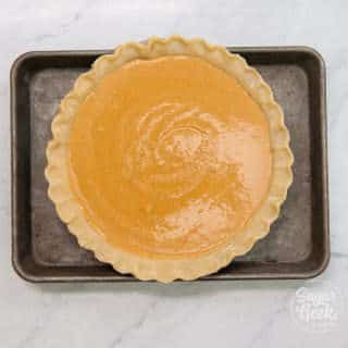 pumpkin pie on sheet pan to prevent spilling