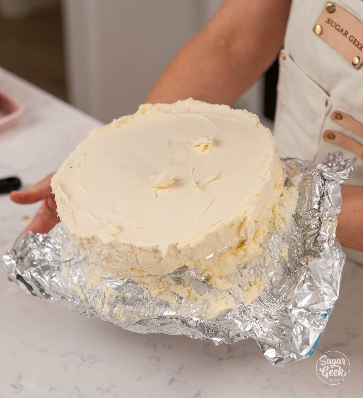 unwrapping ice cream cake layer from aluminum foil