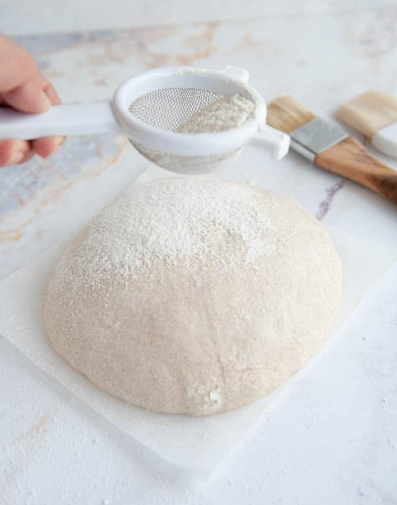 dusting sourdough with flour
