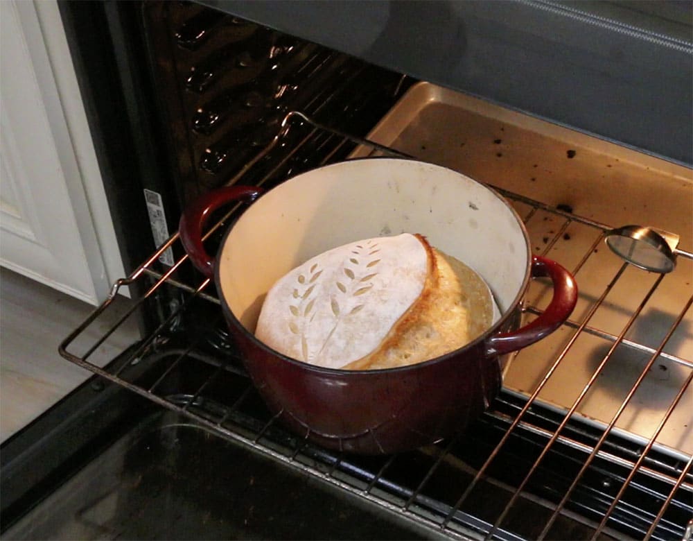 removing the lid from the hot dutch oven