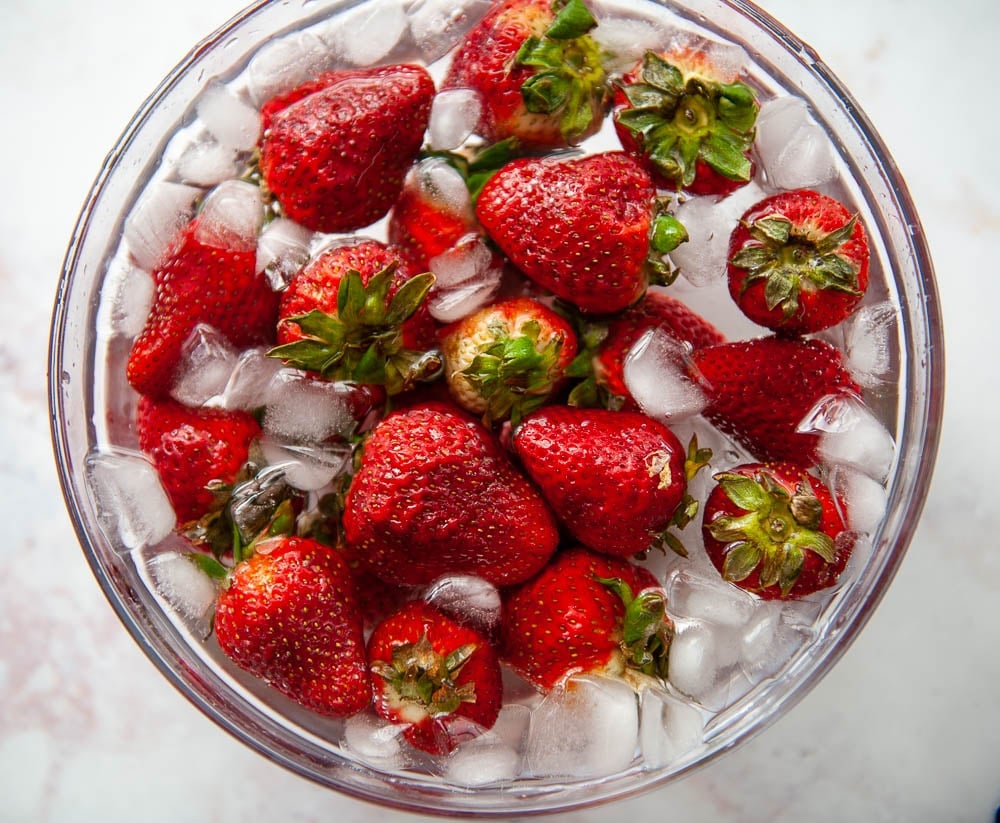 strawberries in ice water