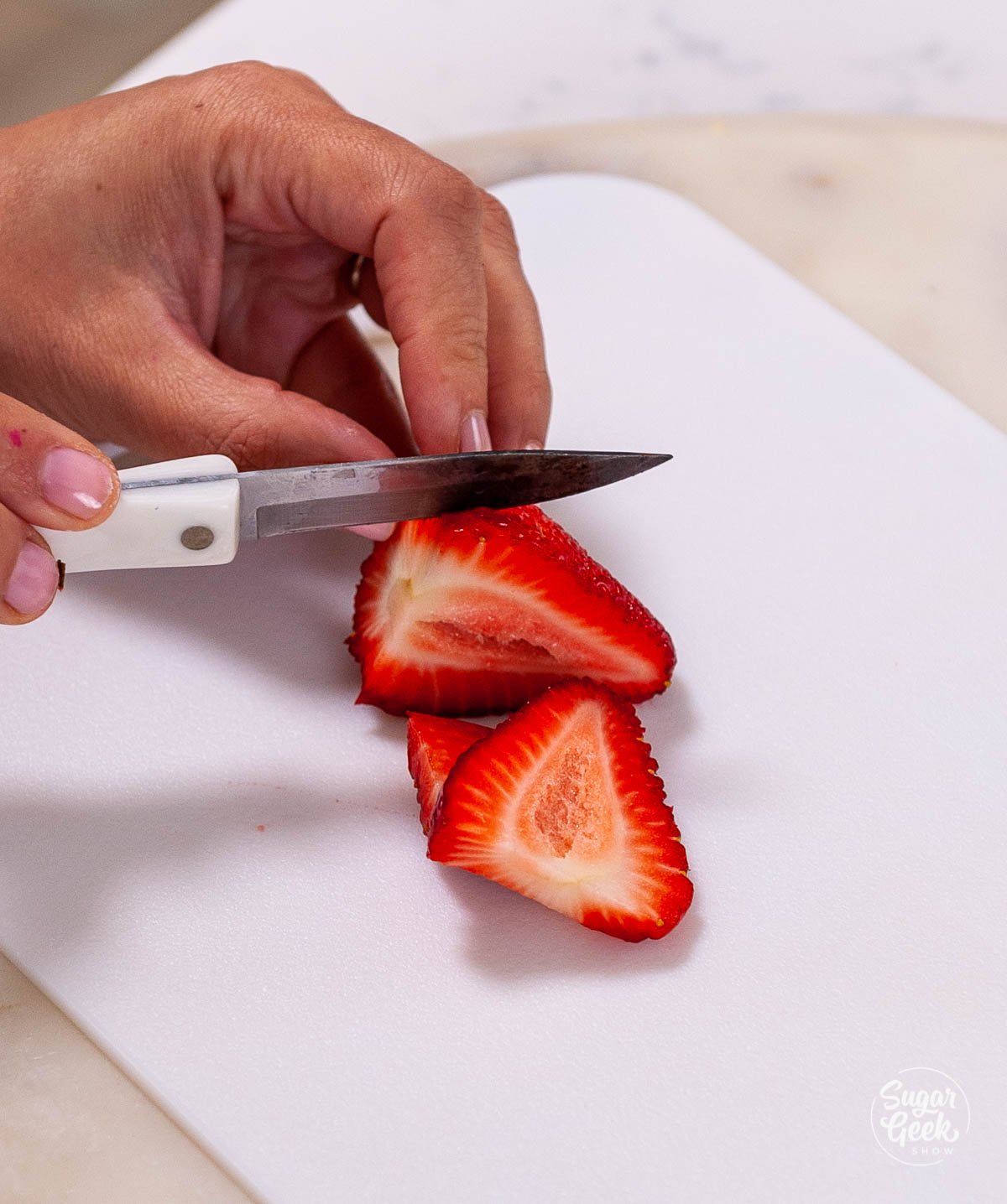 slicing strawberries