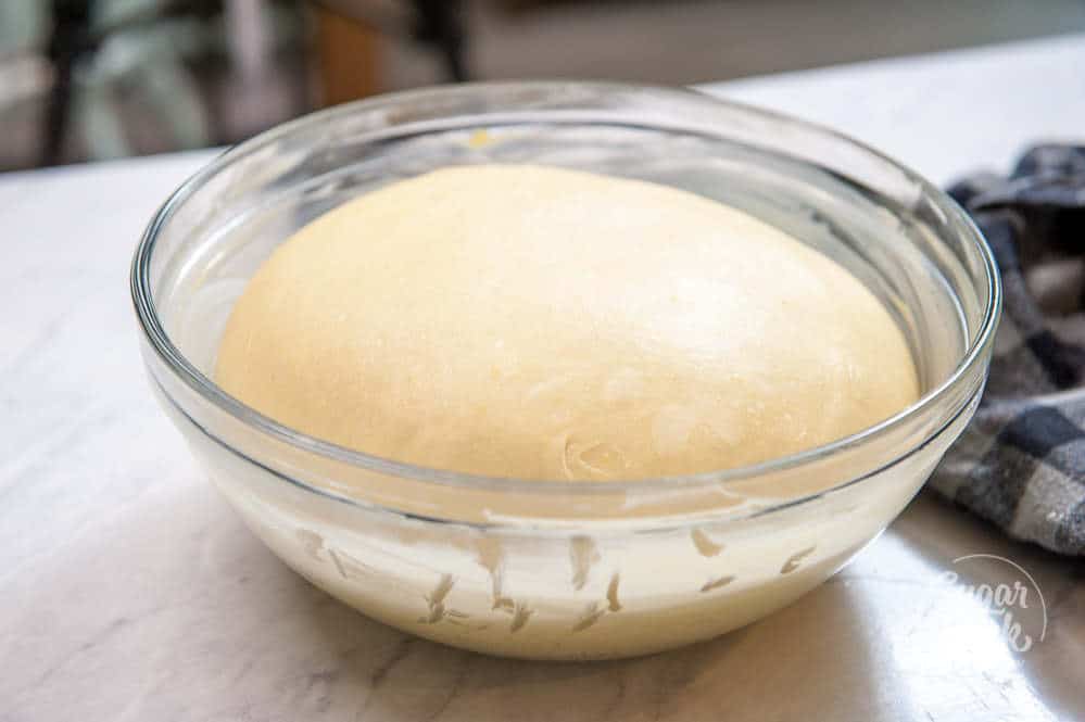 closeup of sweet dough rising in a bowl