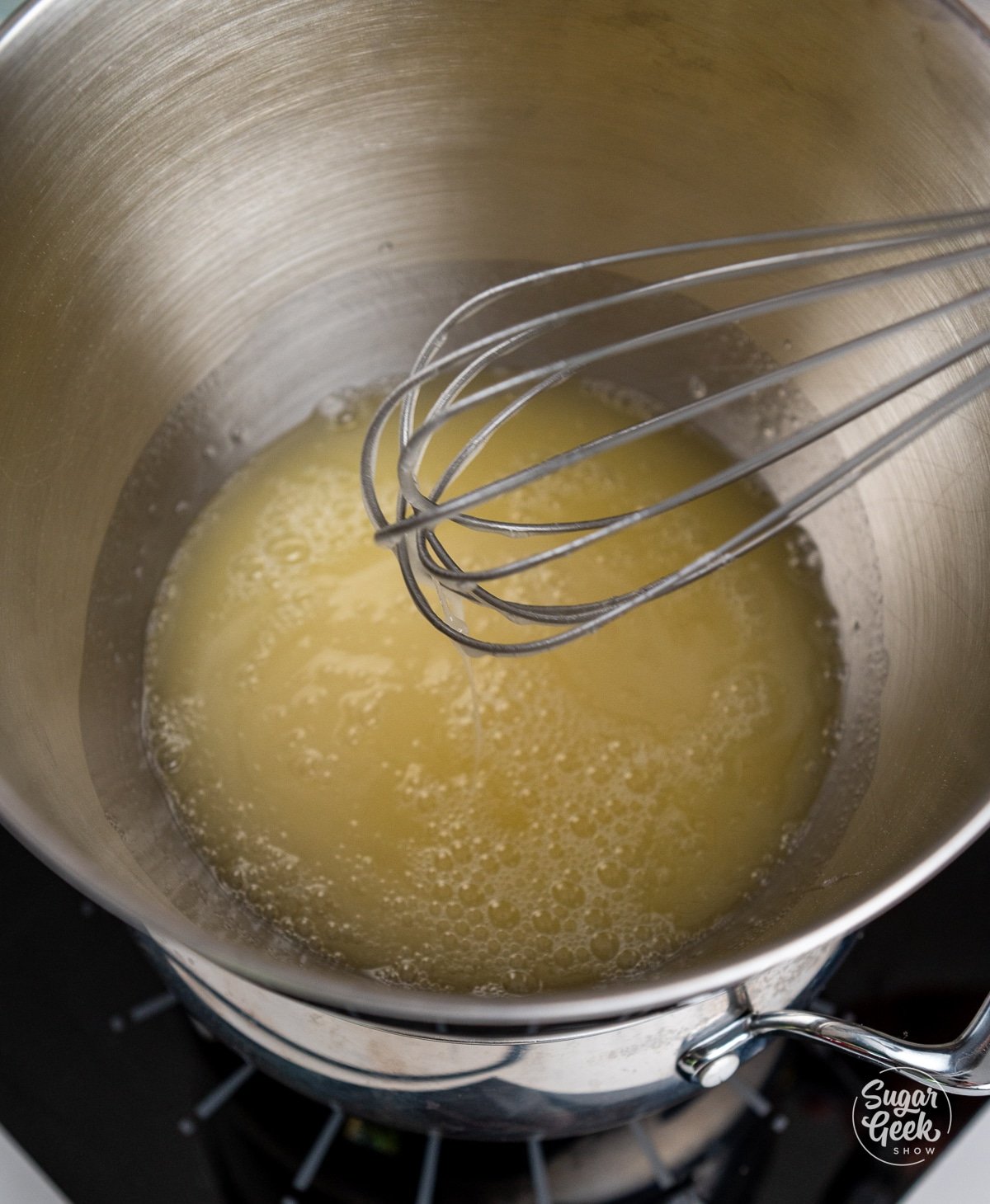 whisking the sugar, egg whites and salt in the stand mixer bowl. 