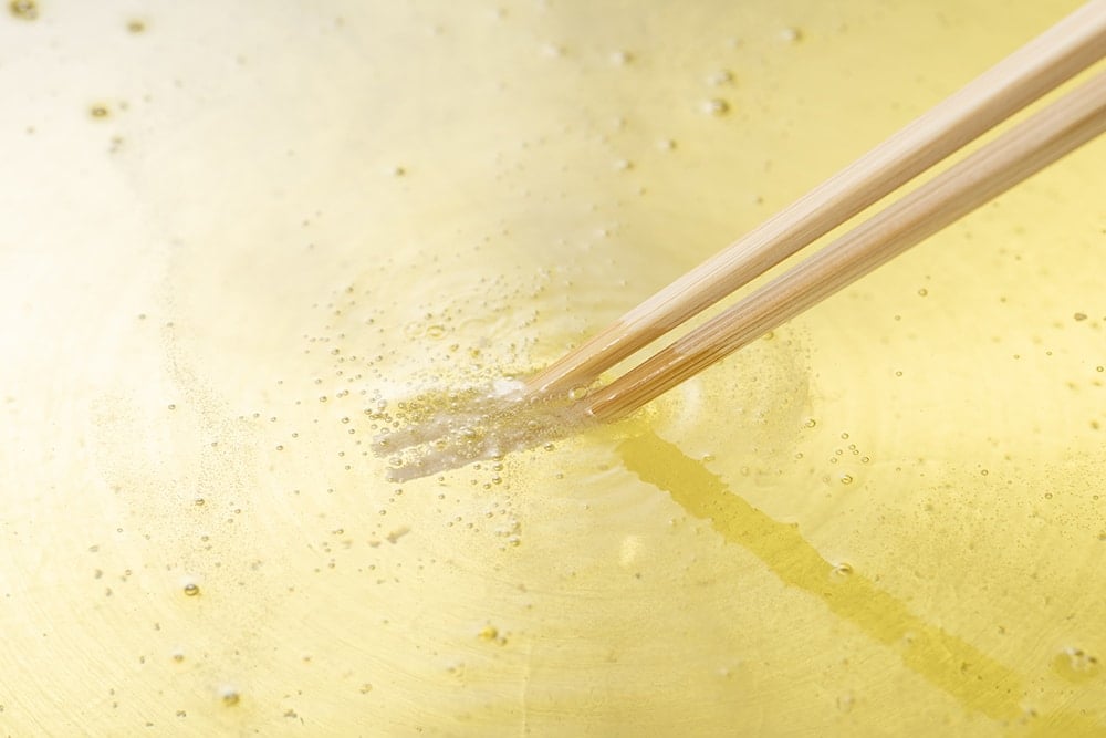 wooden chopsticks in hot oil