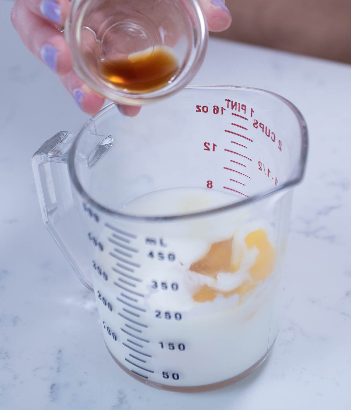 texas sheet cake liquid ingredients in a measuring cup