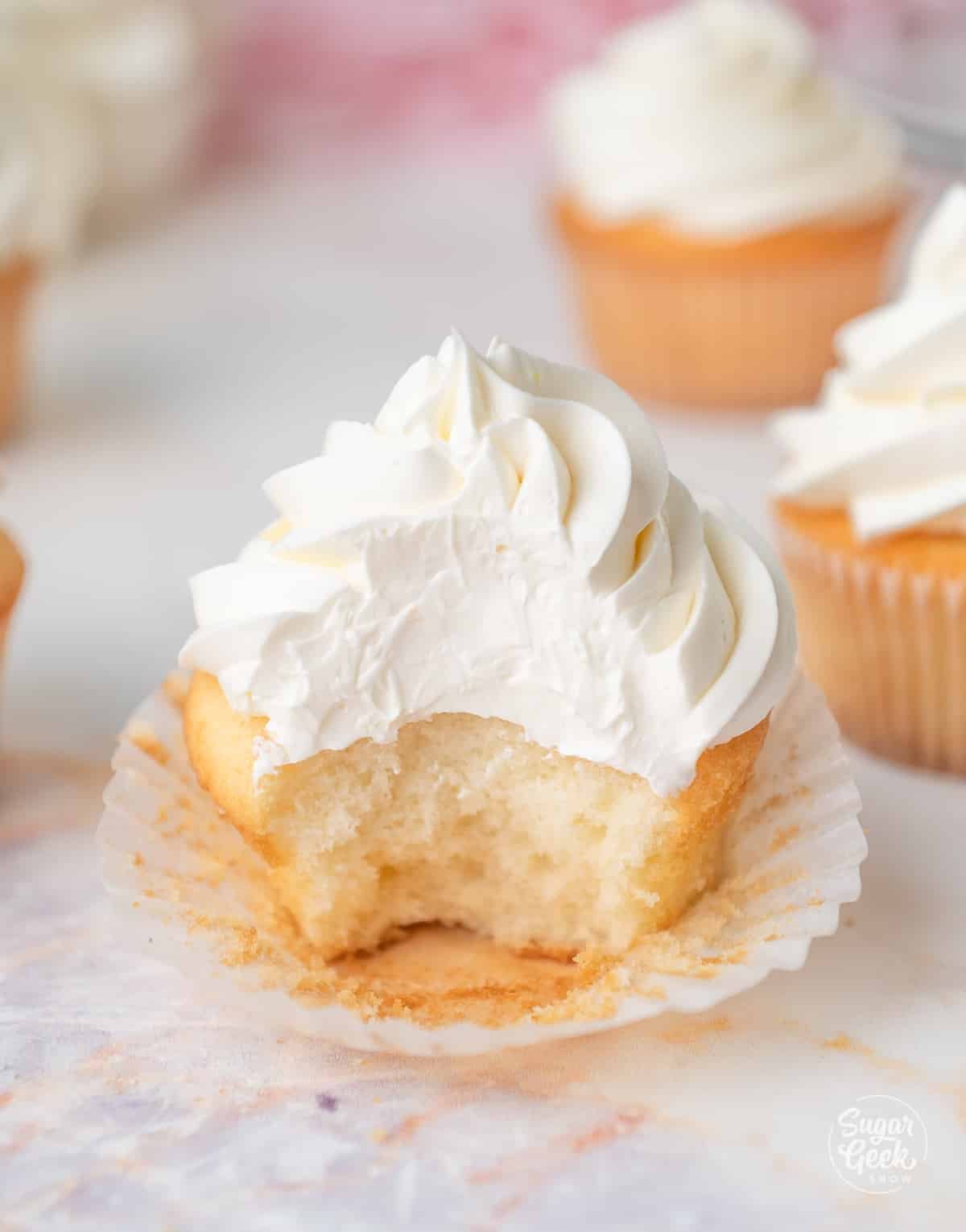 bite out of a vanilla cupcake